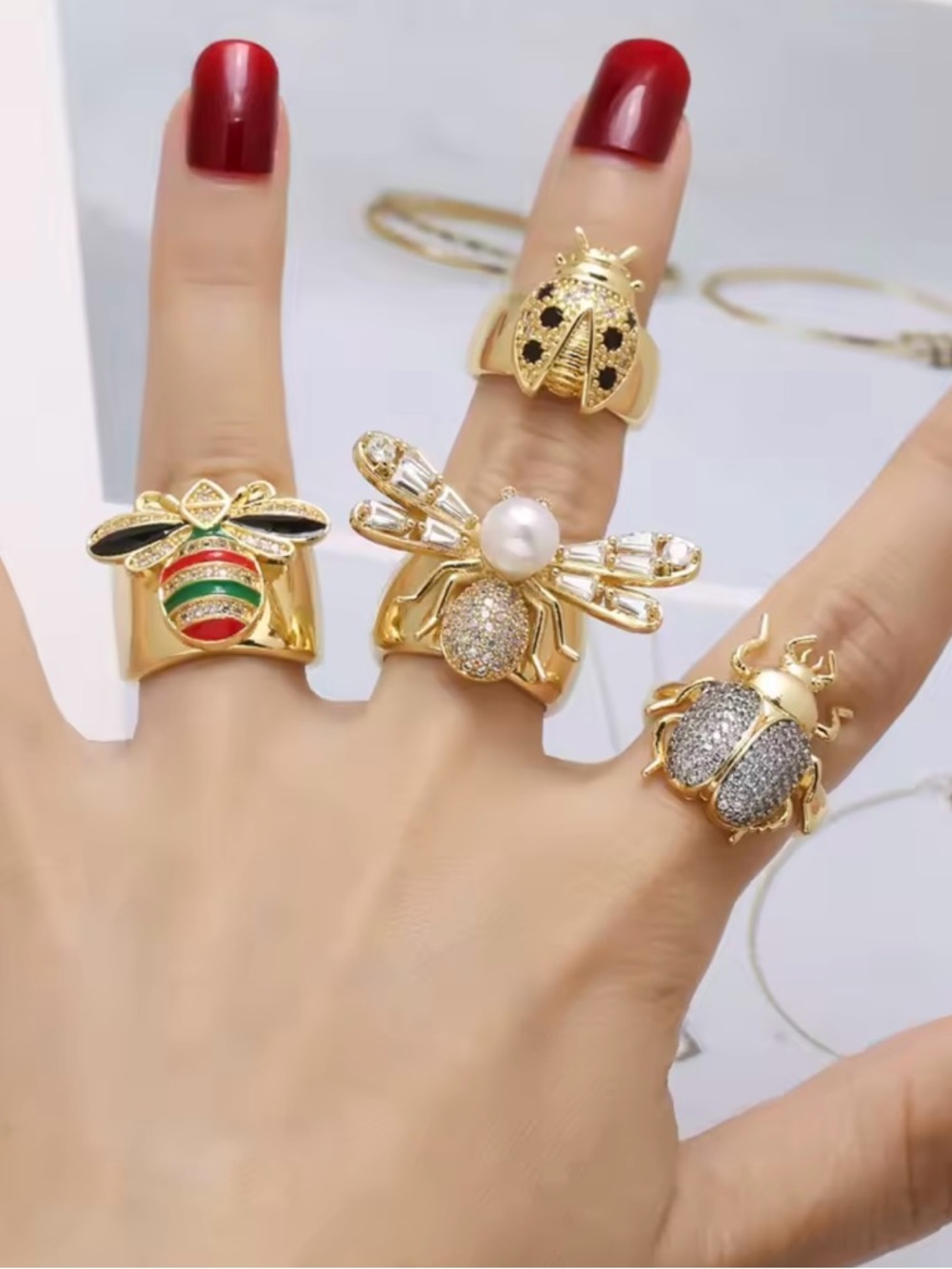 Anthropologie Gold Ring with Red and Green Enamel Bow Accent